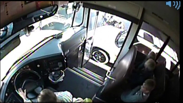 Driver speeds past school bus, nearly hits 3 kids!