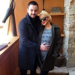 PHOTO: Christina Aguilera shows off her baby bump next to fiance Matt Rutler