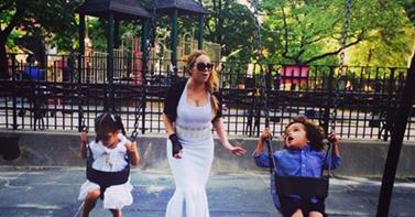 PHOTO: Mariah Carey wears a gown to the playground