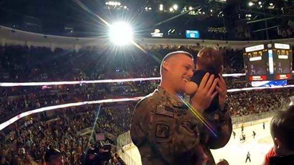 Soldier surprises wife at hockey game & holds newborn son for the first time!