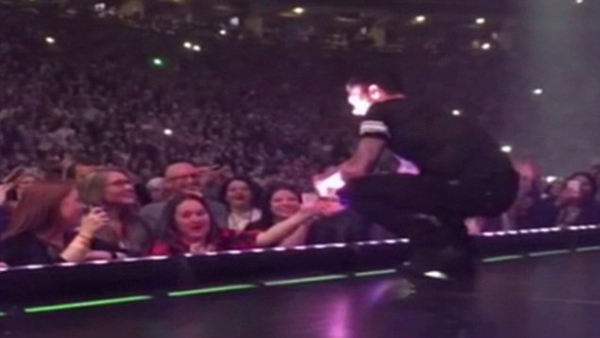WATCH: Adam Levine Accidentally Hits Fan In Head With Mic During Concert