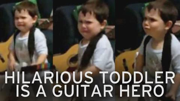 Watch This 2 Year Old Kill It on Guitar Hero!