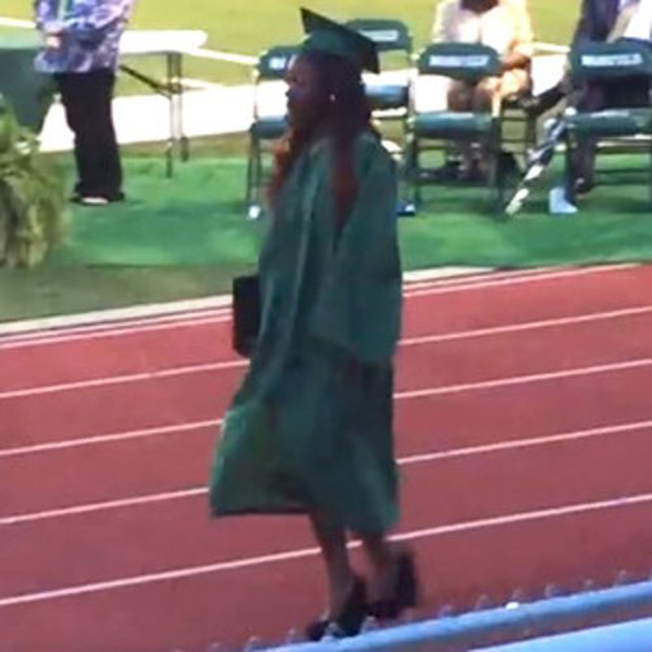 WATCH: This poor girl has the longest, most ridiculous fall ever at her high school graduation!